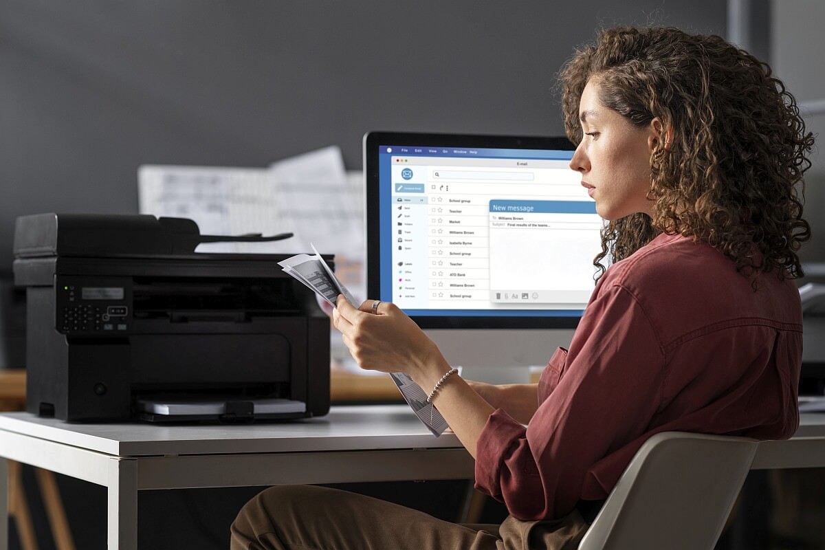 medium-shot-woman-sitting-desk